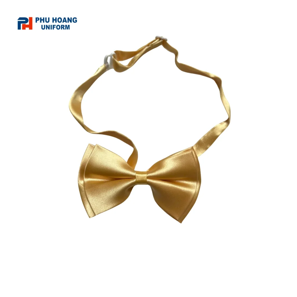 Nơ vàng phục vụ may sẵn Nơ phục vụ màu vàng may sẵn nổi bật với thiết kế gọn gàng, dễ đeo và phù hợp phối cùng áo sơ mi đồng phục. Sản phẩm thích hợp cho nhân viên nhà hàng, khách sạn, tiệc cưới, sự kiện và dịch vụ ăn uống.
